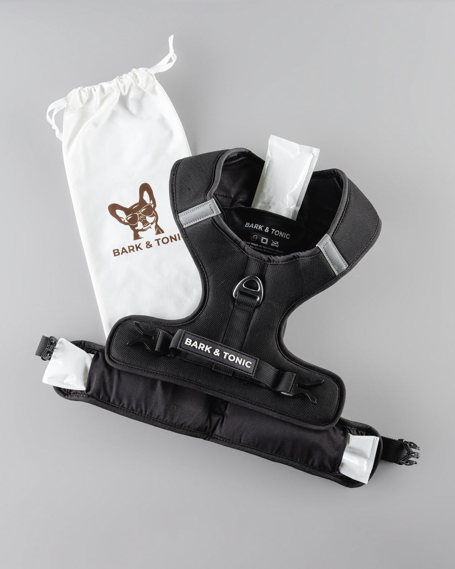 Bark & Tonic cooling gel packs sliding into the insulated pockets of the Signature harness